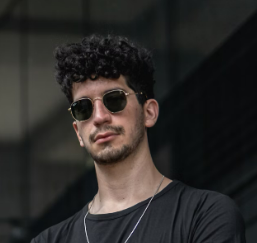 a guy in glasses and a black T-shirt
